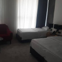 اتاق چهارتخته بالکن دار ویو شهر ودریا هتل بزرگ خورشید بوشهر